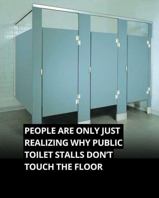 Why do public bathroom doors not reach the floor?